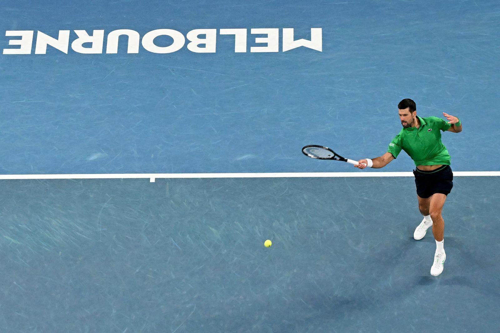 Image may contain ball sports, tennis, racquet, tennis racket and people