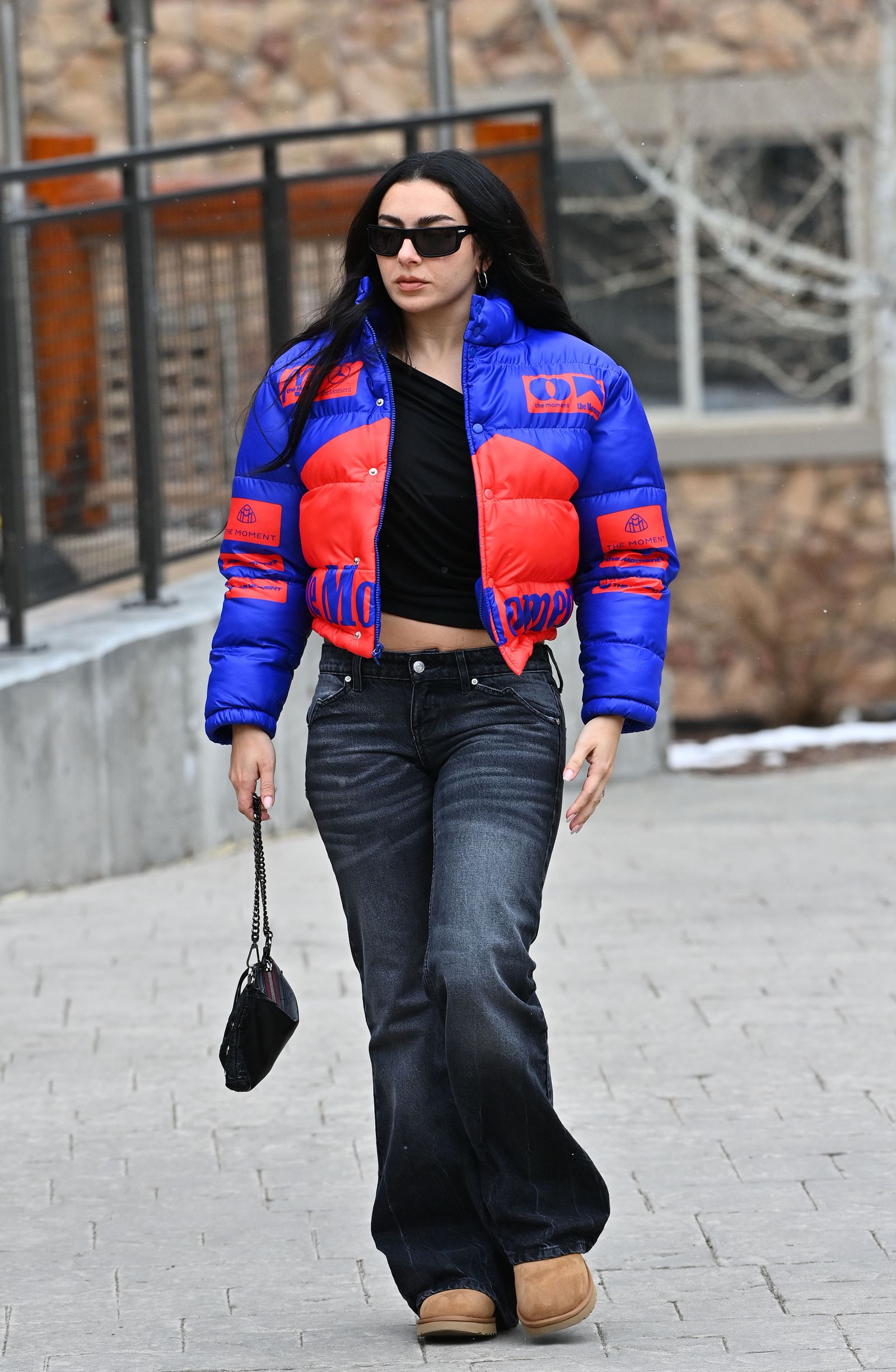 Image may contain Charli XCX clothing pants coat jacket jeans adult brunette hair accessories and bag