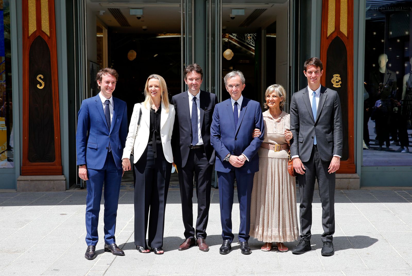 Image may contain Bernard Arnault, Antoine Arnault, Delphine Arnault, group photo, adult accessories and formal wear