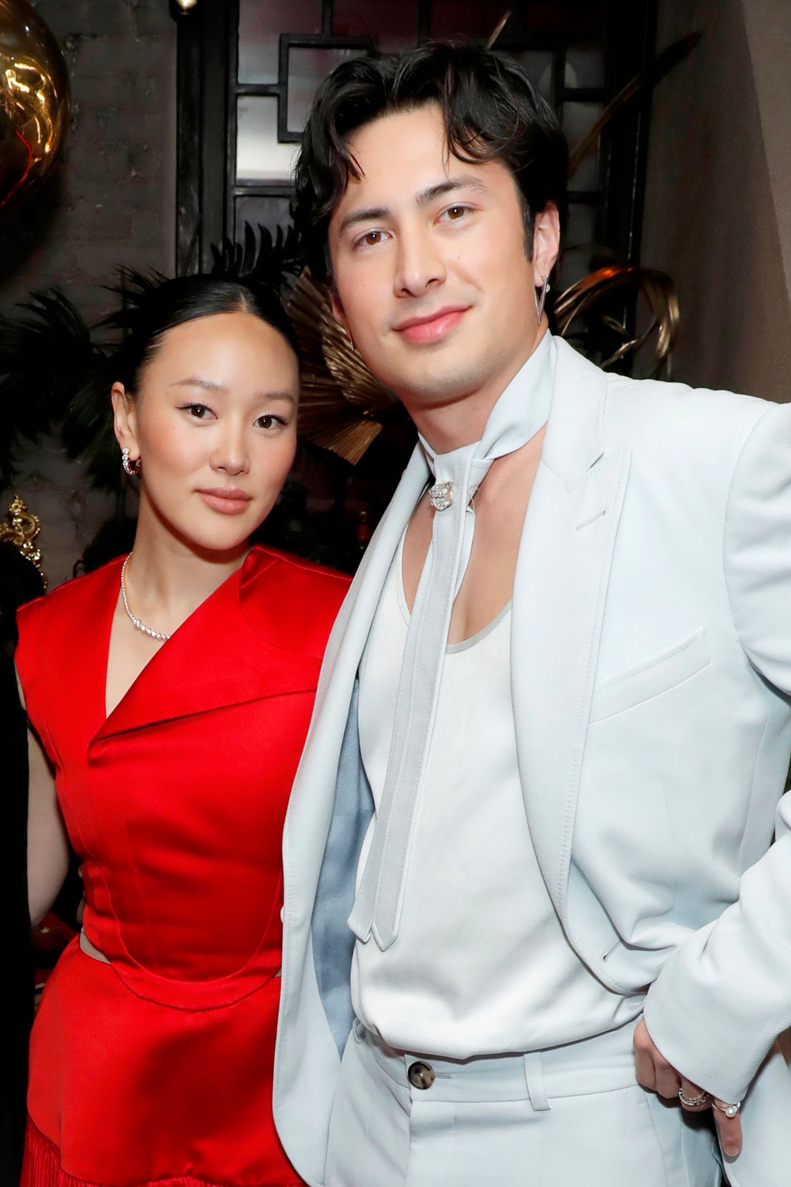 Image may contain people blazers, coats, jackets, adult formal suits, photobombed faces and heads