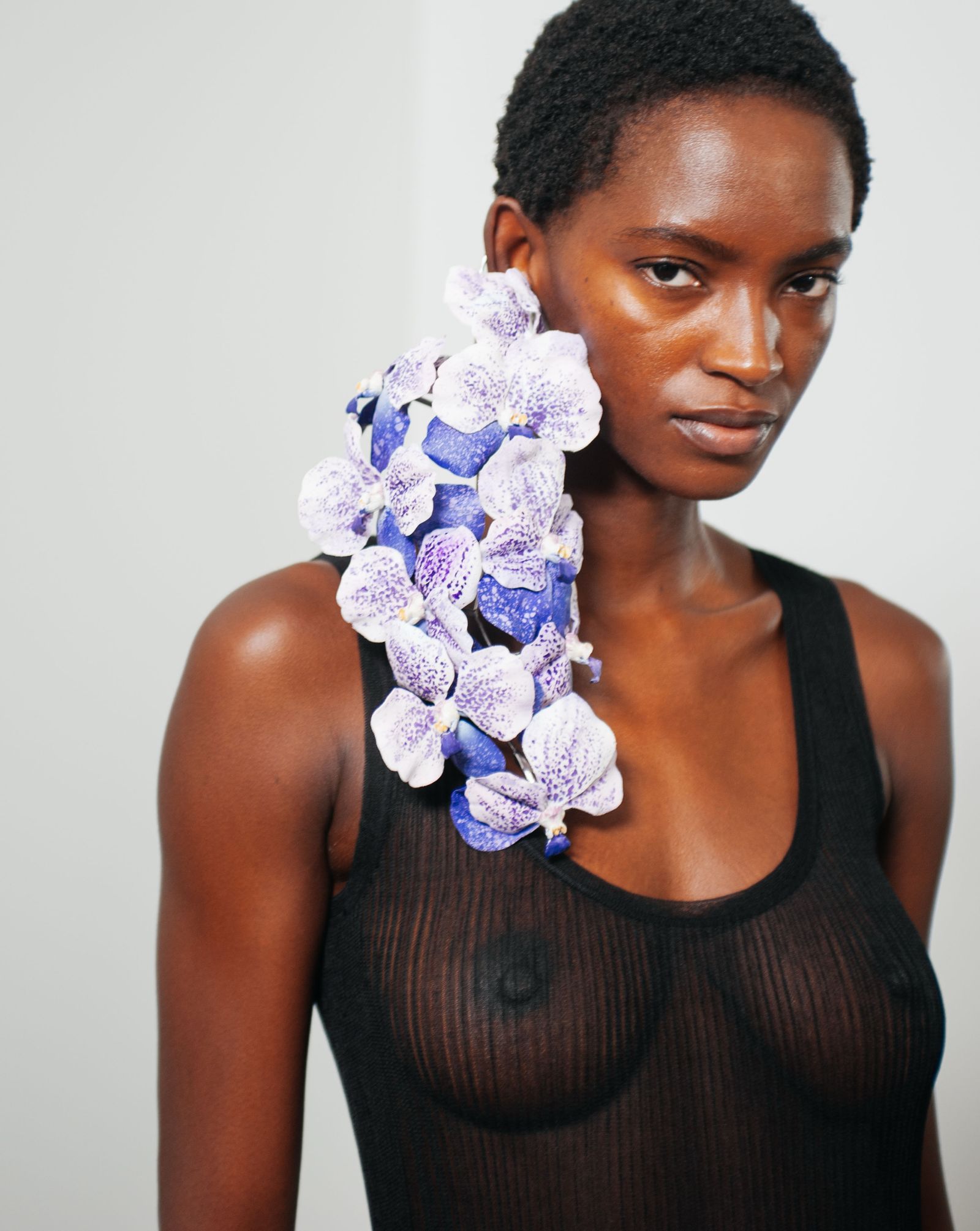 Images may contain faces, heads, photographic portraits of people, adult body parts, shoulders, flowers, plants and necks