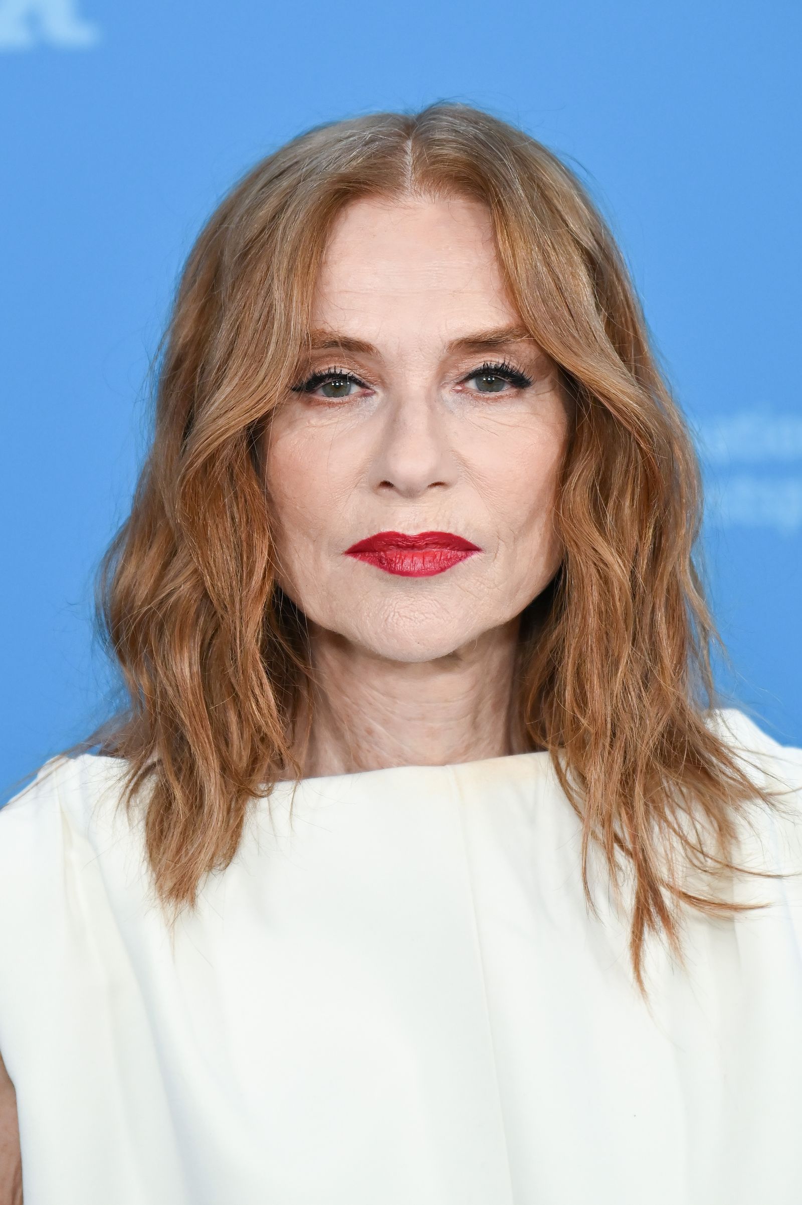 Image may contain Isabelle Huppert blonde, face, head photography, portrait, adult cosmetics and lipstick