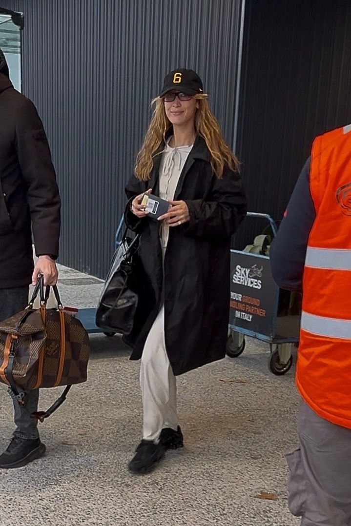 Image may contain Soledad Solaro clothing, outerwear, adults, pedestrians, accessories, bags, totes and baseball caps