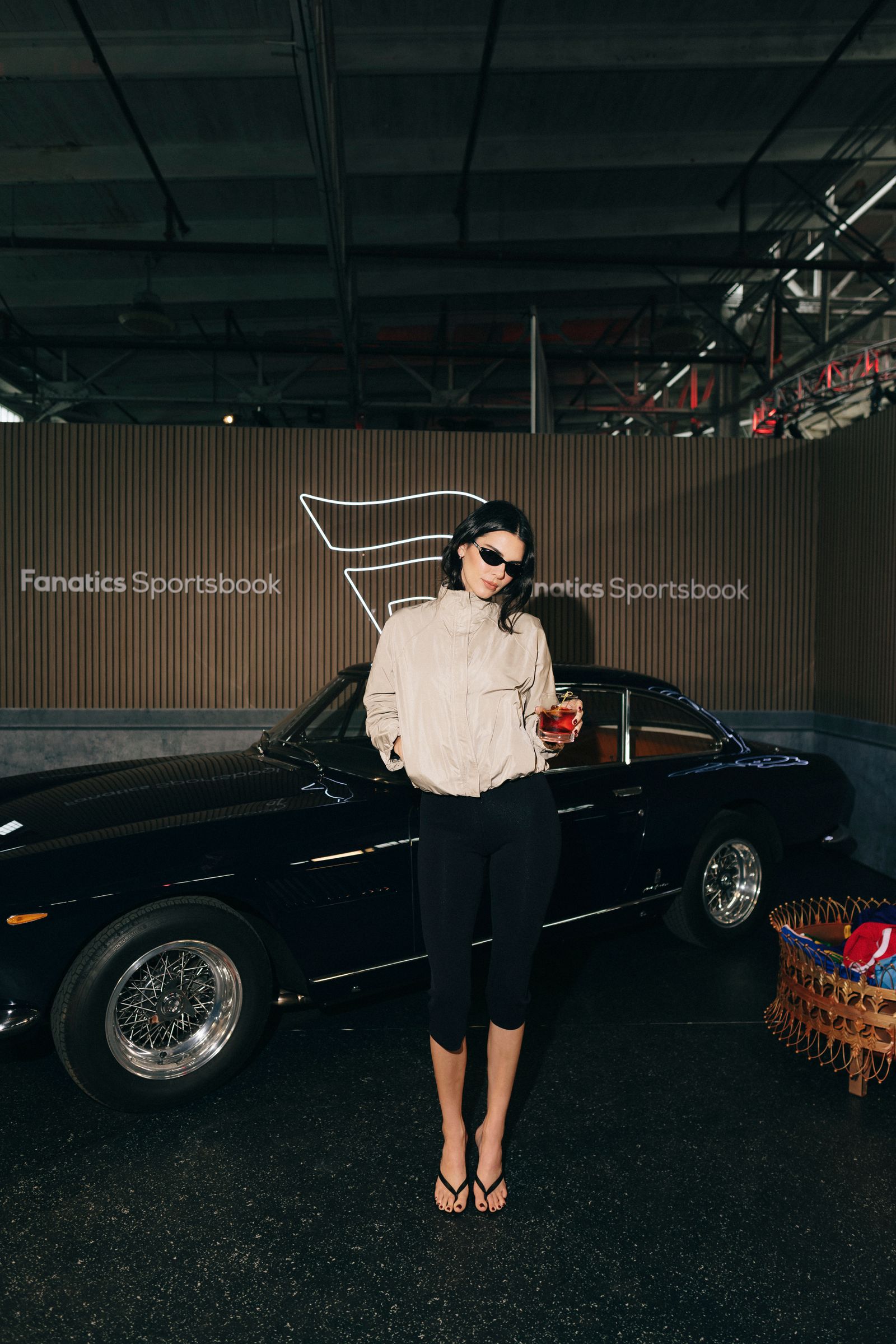 Image may contain Kendall Jenner Clothing Sleeves Machine Wheels Spokes Adult Tires Alloy Wheels and Cars