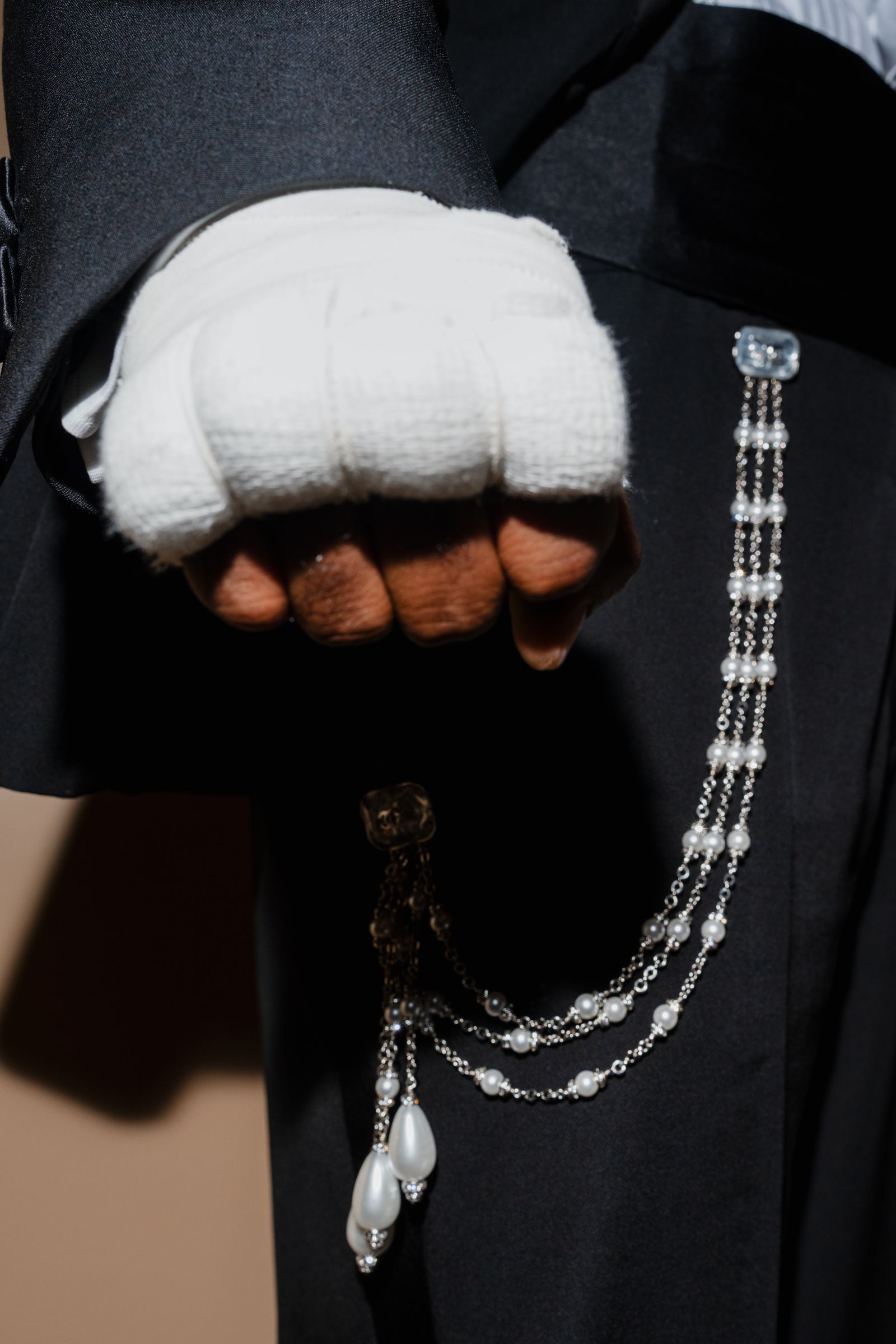 Image may contain body parts, fingers, hands, adult clothing and gloves