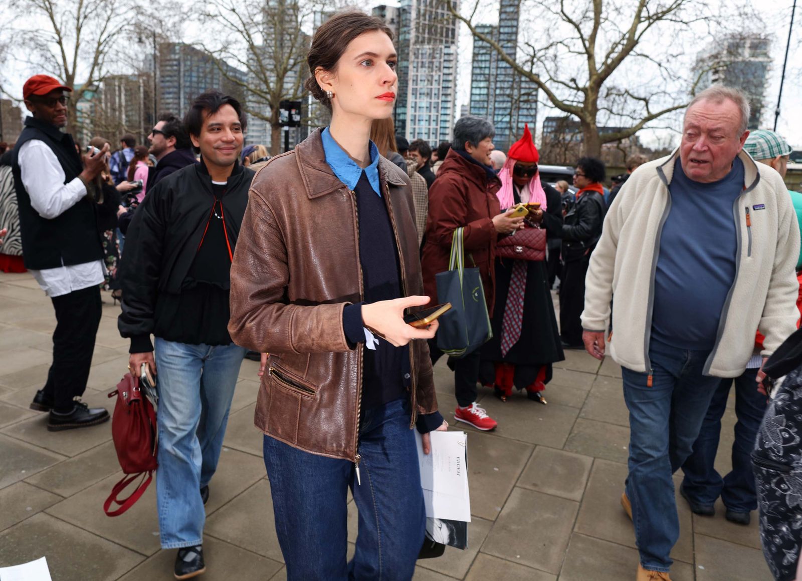 The image may contain Midori Shintani Bong Joonho clothing coats jackets pants adult ads and posters