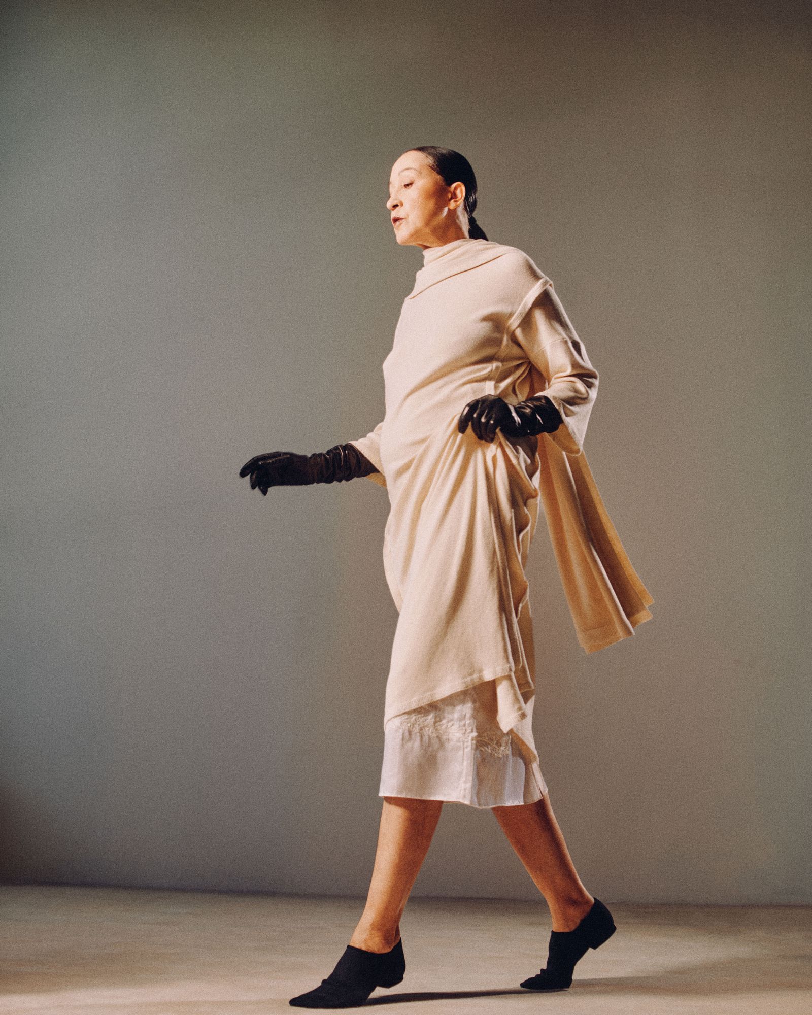 Image may contain Pat Cleveland adult apparel, gloves, outerwear, fashion solo performers and footwear