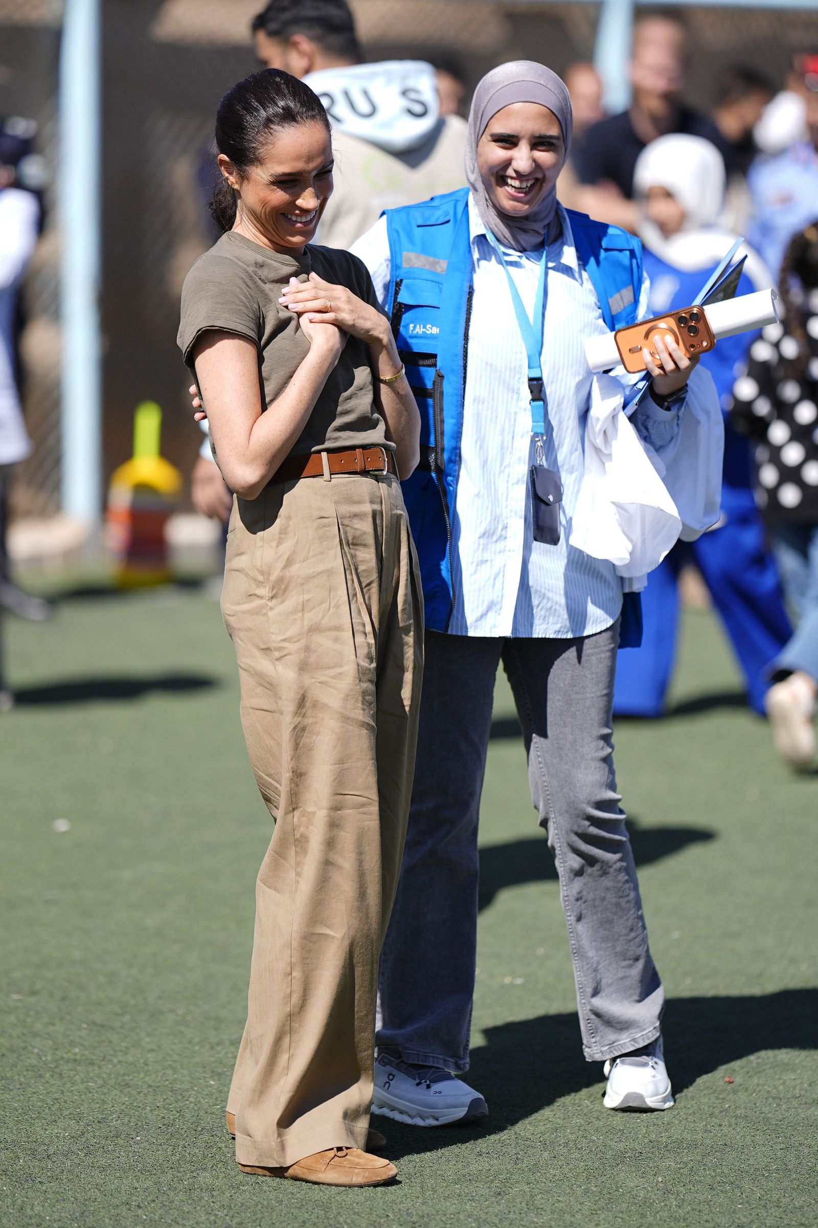 Image may contain Meghan Duchess of Sussex Laila Alawa Brian Folkerts people clothing, coats, jackets and officers