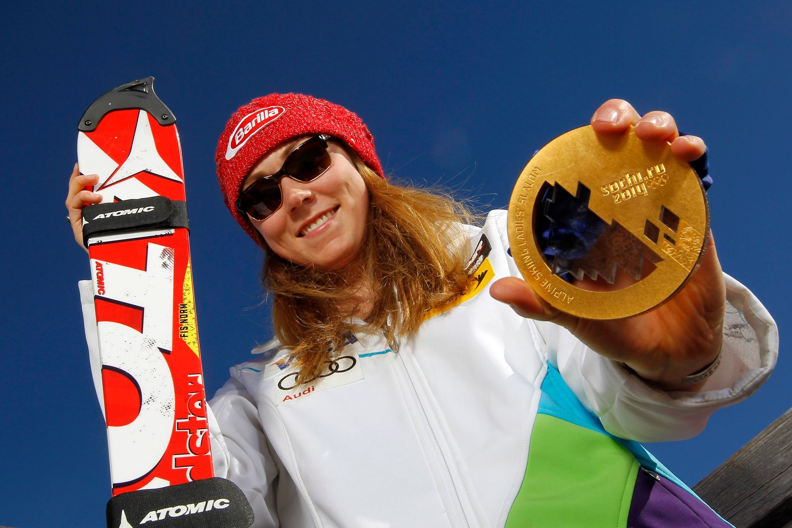 Image may contain Gina Hathorn Accessories Sunglasses Cap Clothing Hat Gold Coat Face Head People & Photography