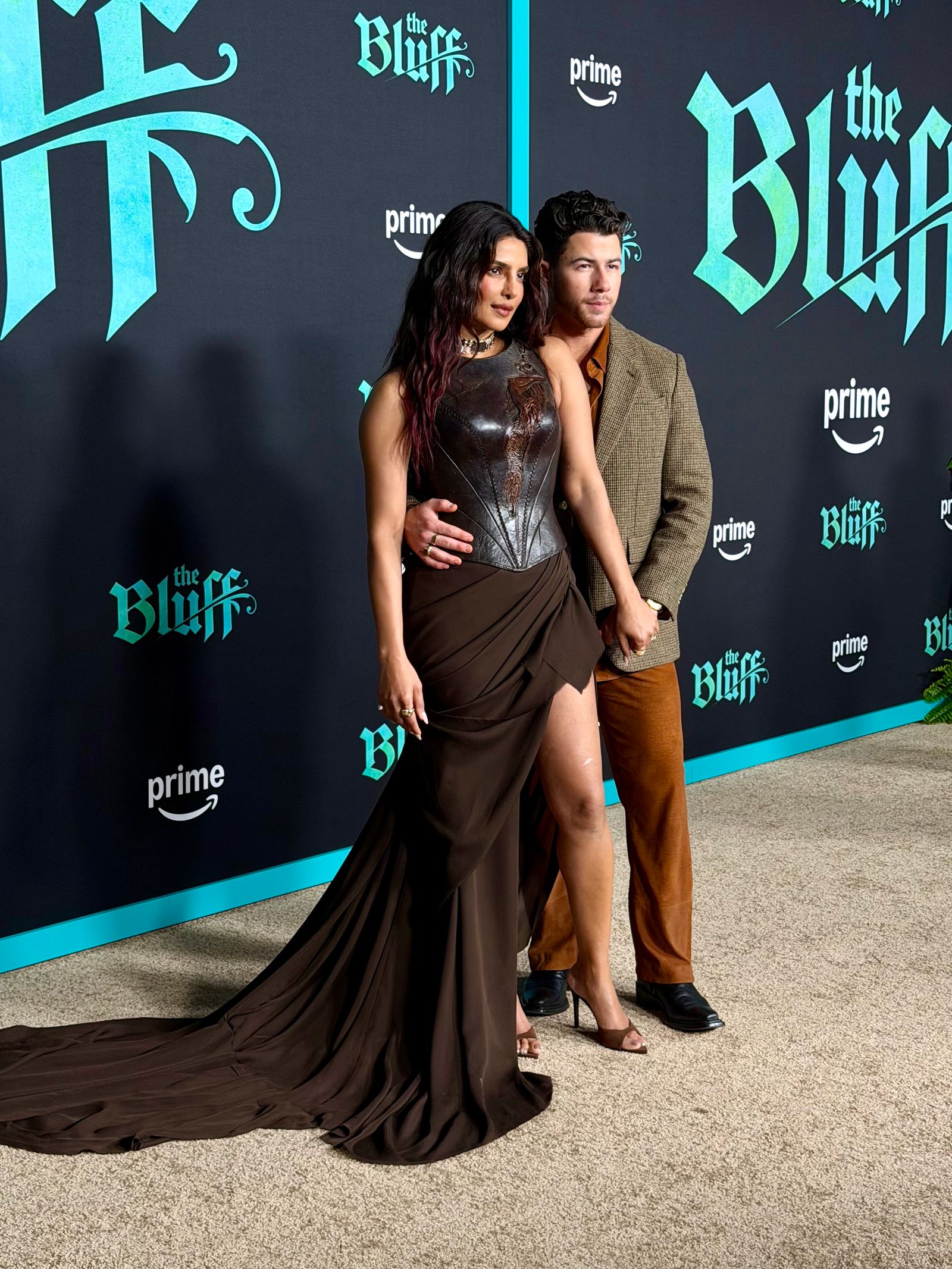 Image may contain Nick Jonas Priyanka Chopra Fashion Photobombing and Adult
