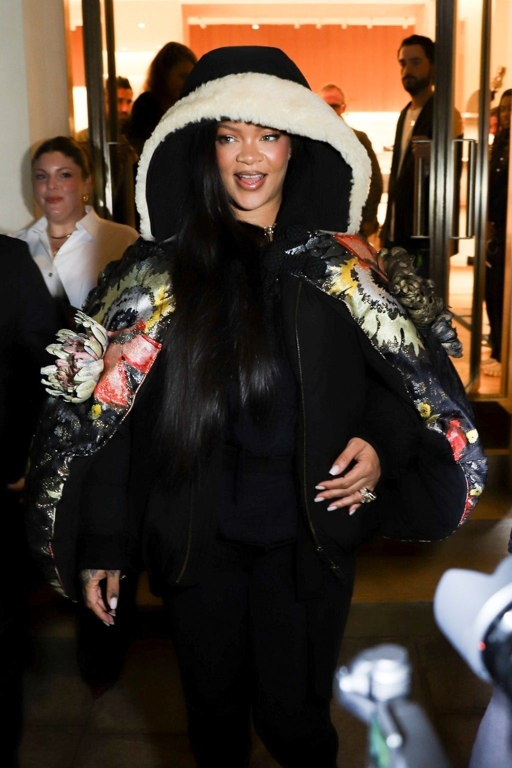 Rihanna is all smiles after shopping at Dior in Paris