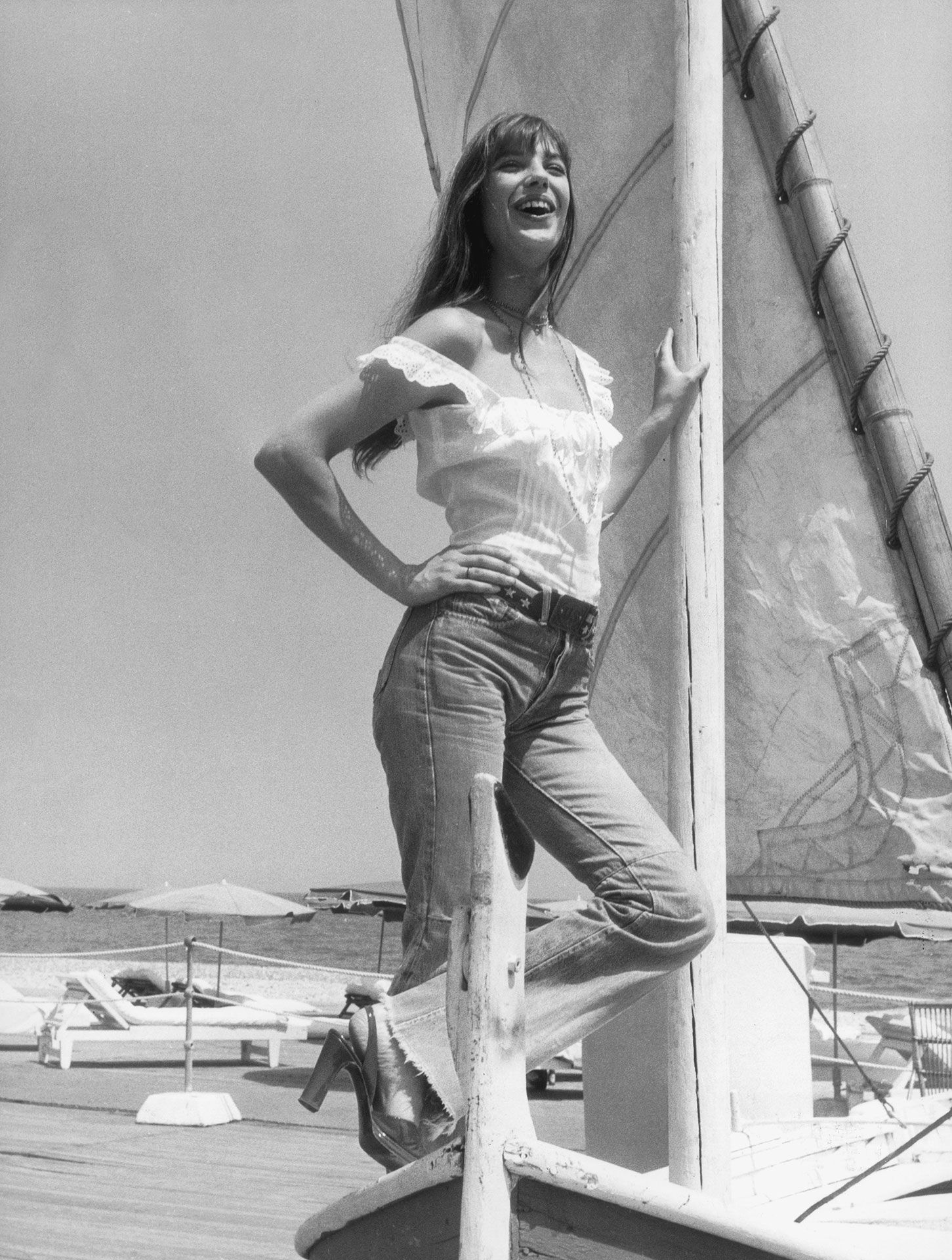 Image may contain Jane Birkin clothing, pants, face, head, people photography, portraits, boats and sailing boats