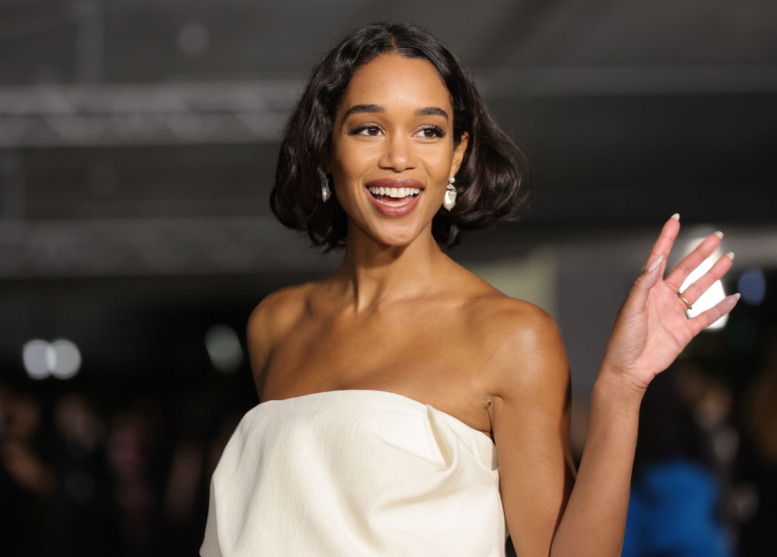 Image may contain Laura Harrier Head FaceHappy Smile Black Hair Hair Dimples Photography and Portraits