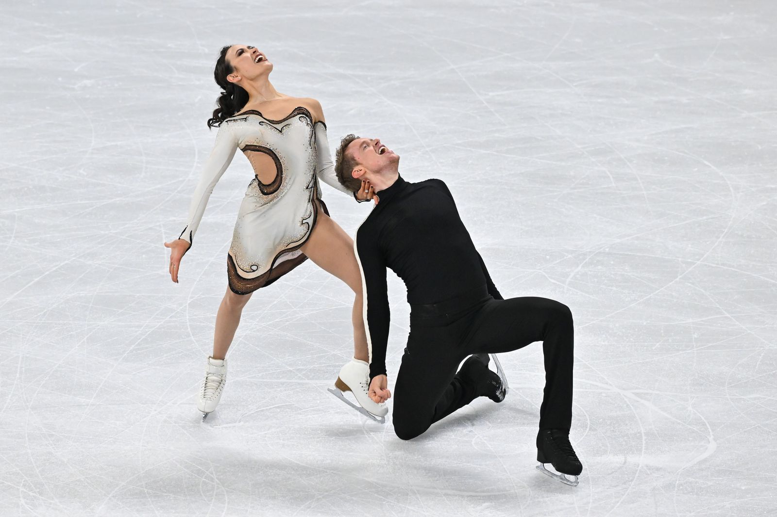 Image may contain Evan Bates Madison Chock Ice Skating Dance Performer Ice Rink and Sports