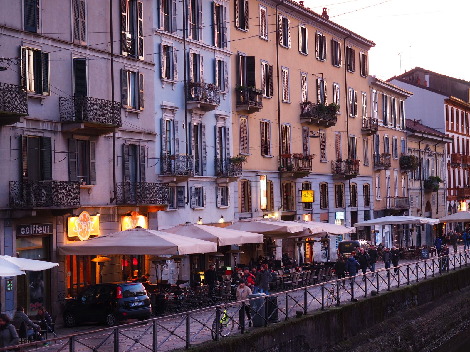 Image may contain City Urban Road Street Apartment Building Architecture Building High Rise Neighborhood and Person