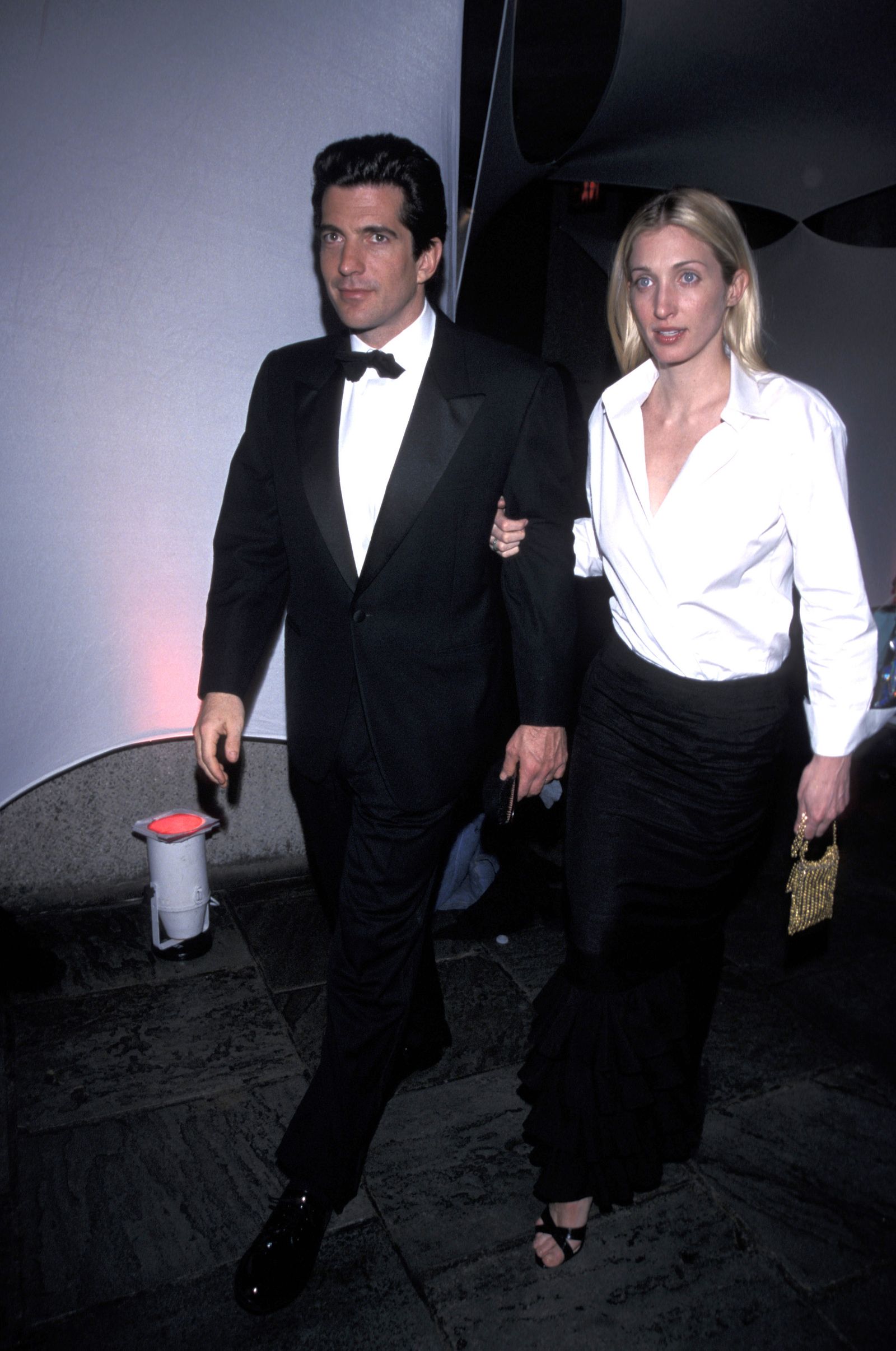 Image may contain John F. Kennedy Jr. Carolyn BessetteKennedy Clothing Formal Suits Stylish Blazers and Coats