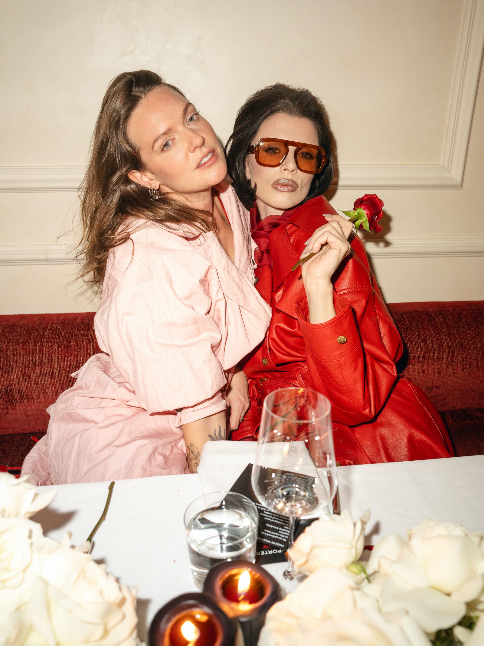 Image may contain Tove Lo clothing, coats, jackets, glass flowers, plants, roses, dining table, furniture and tables