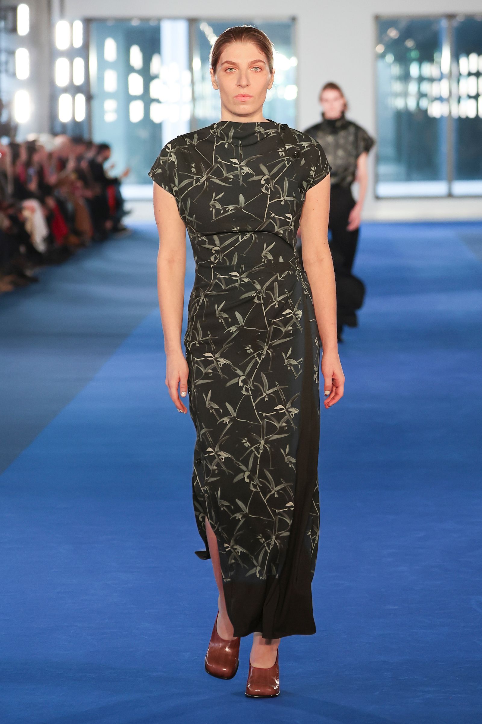 Image may contain clothing, dress, fashion, formal wear, evening dress, adult and people