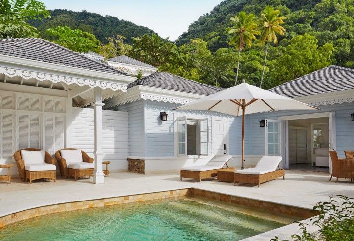 Image may contain buildings, buildings, hotels, resorts, houses, villas, swimming pools, water, hot tubs and bathtubs