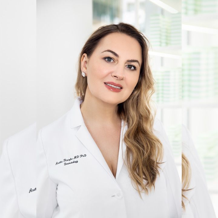 Image may contain Clothing Coat Lab Coat Adult Person Face Head Photography and Portrait