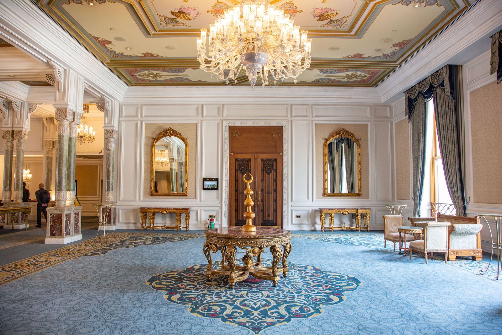 Image may contain chandelier, home decor, interior architecture, architecture, foyer, interior design and flooring