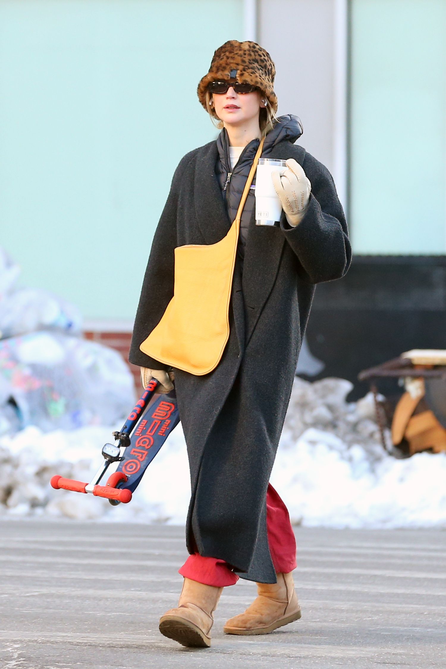 Image may contain Jennifer Lawrence clothing, coats, gloves, people, toys, accessories and eyewear