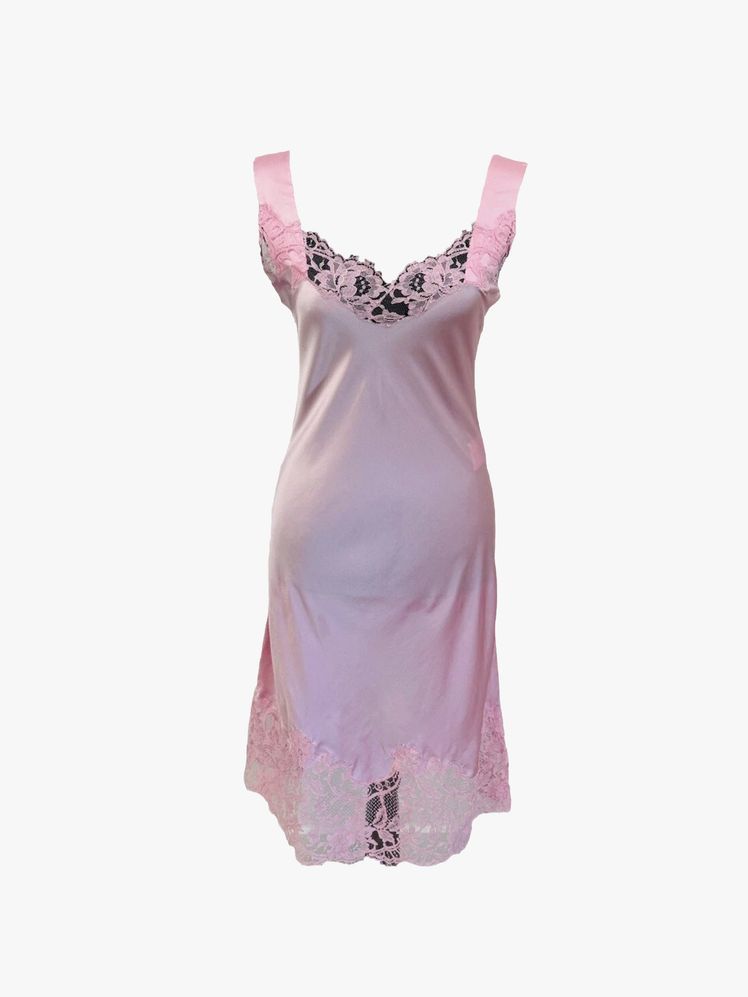 Image may contain: clothing, dress, formal wear, shirt and people