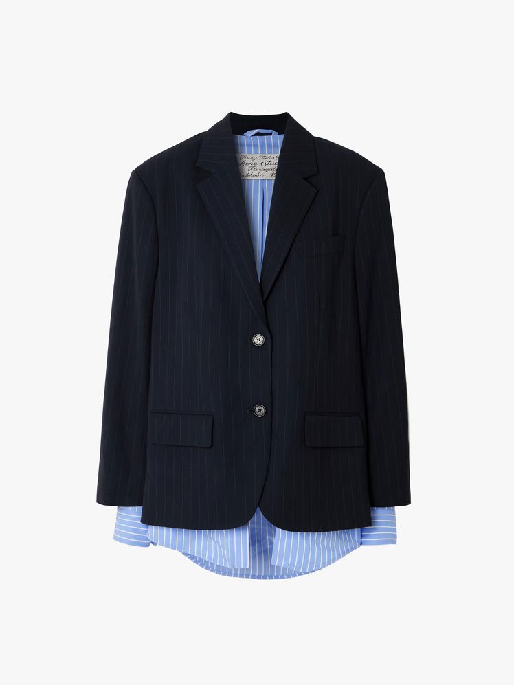 Image may contain: blazer, clothing, coat, jacket, formal suit and suit