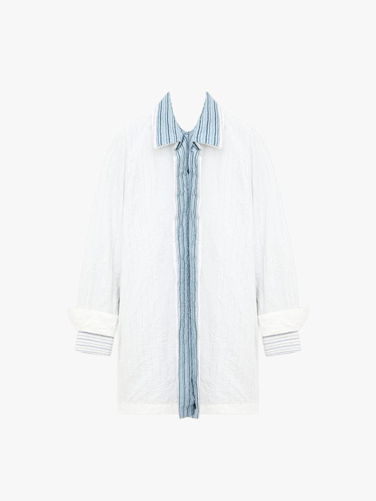 Image may contain: clothes, coat, home decor, linen, long sleeves, sleeves and lab coat