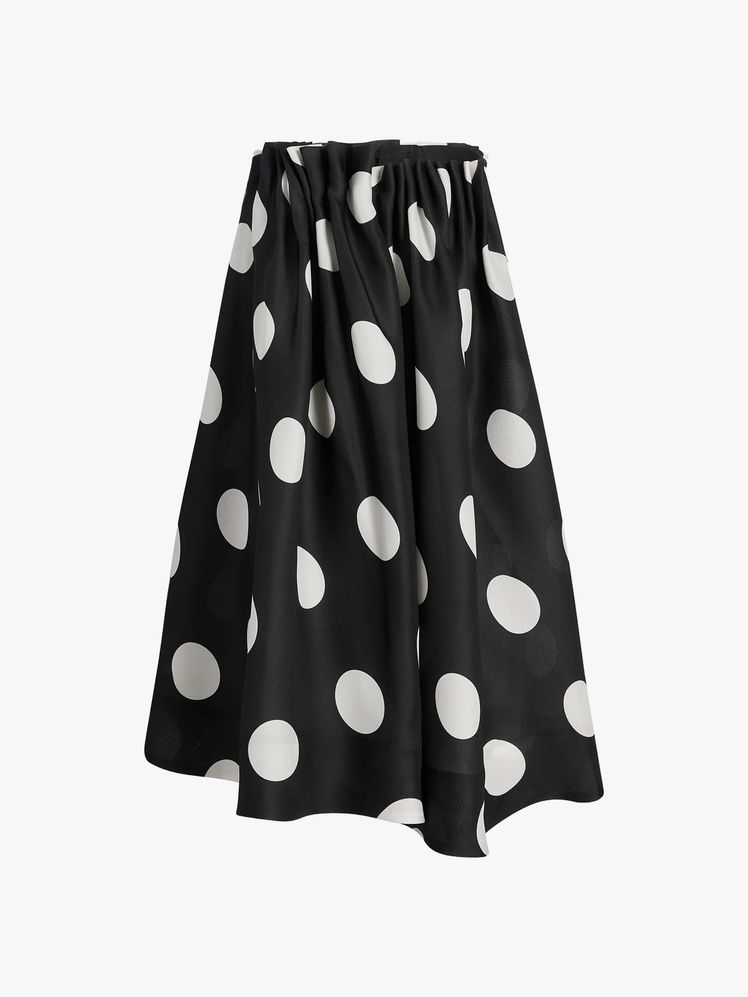 Image may contain: clothes, skirt, pattern and jacket