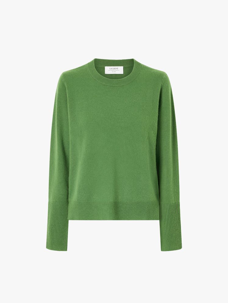 Image may contain: clothing, long sleeves, sleeves, knitwear, sweater and sweatshirt