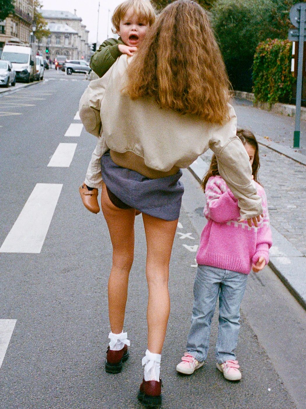 Image may contain La Parka Clothing Shorts City Road Street Urban Child Person Pants Baby Brown Hair & Hair