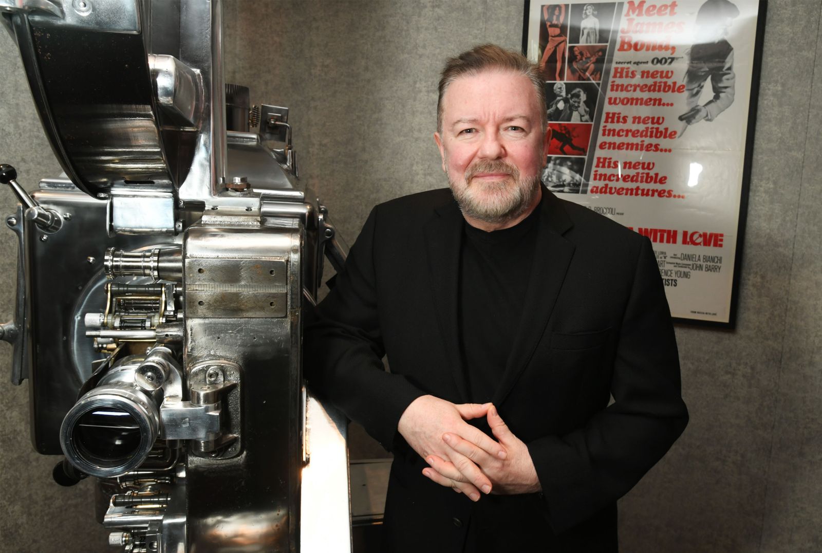 Image may contain Ricky Gervais face, head, people photography, portraits, adult body parts, fingers, hands and equipment