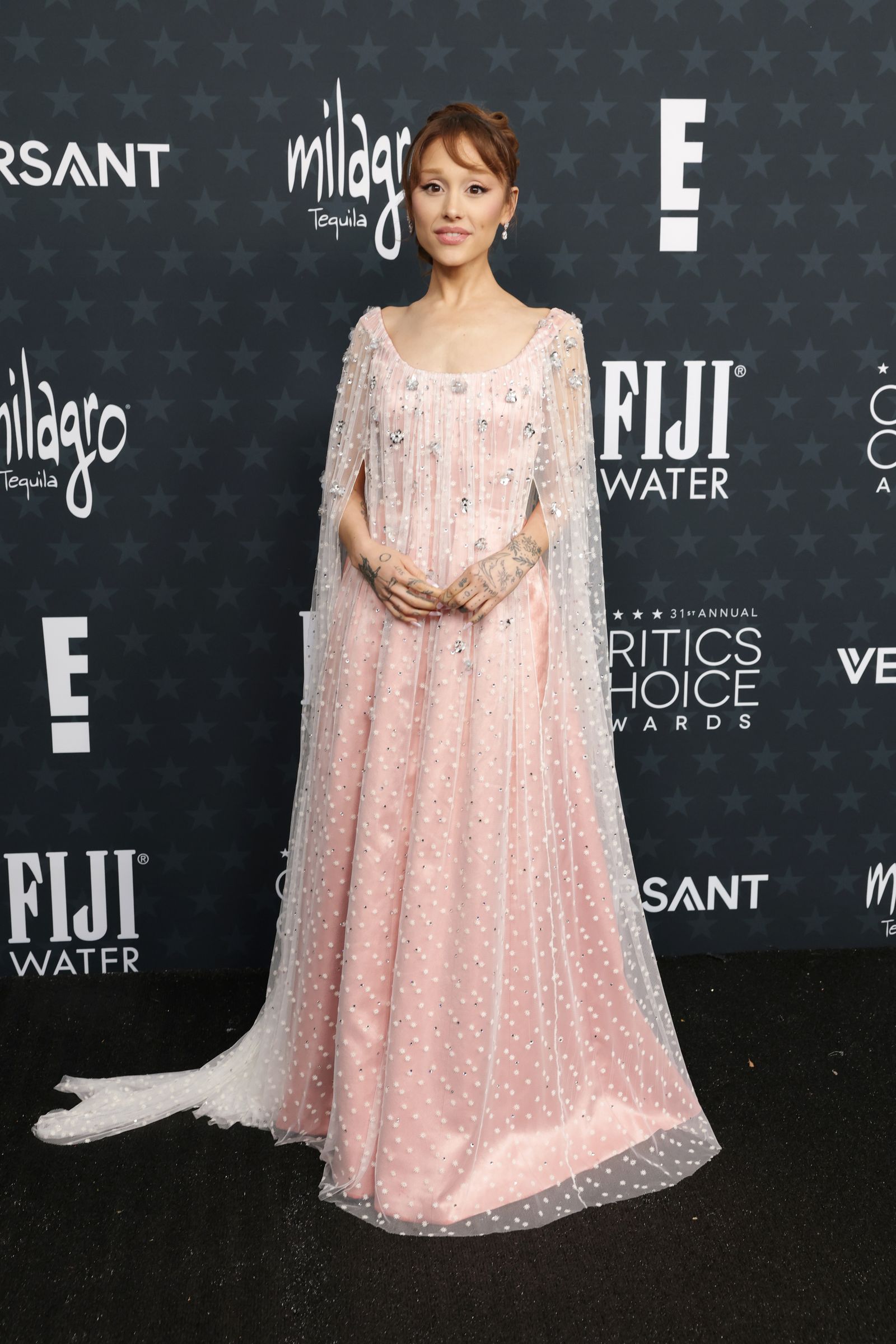 Image may contain Ariana Grande Fashion Clothing Dresses Formal Dresses Wedding Sleeves and Adults