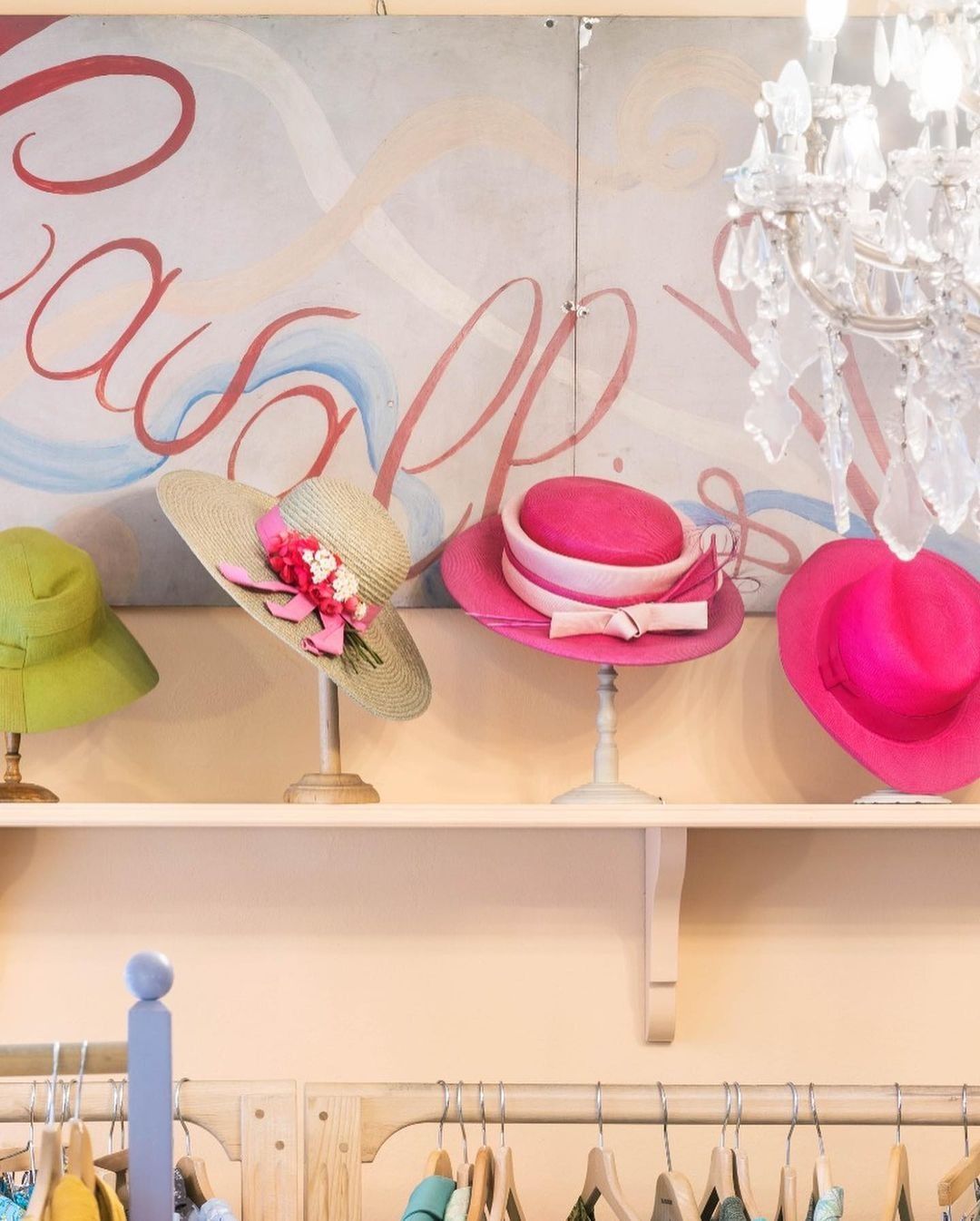 Image may contain clothing, hat, locker room interior and room