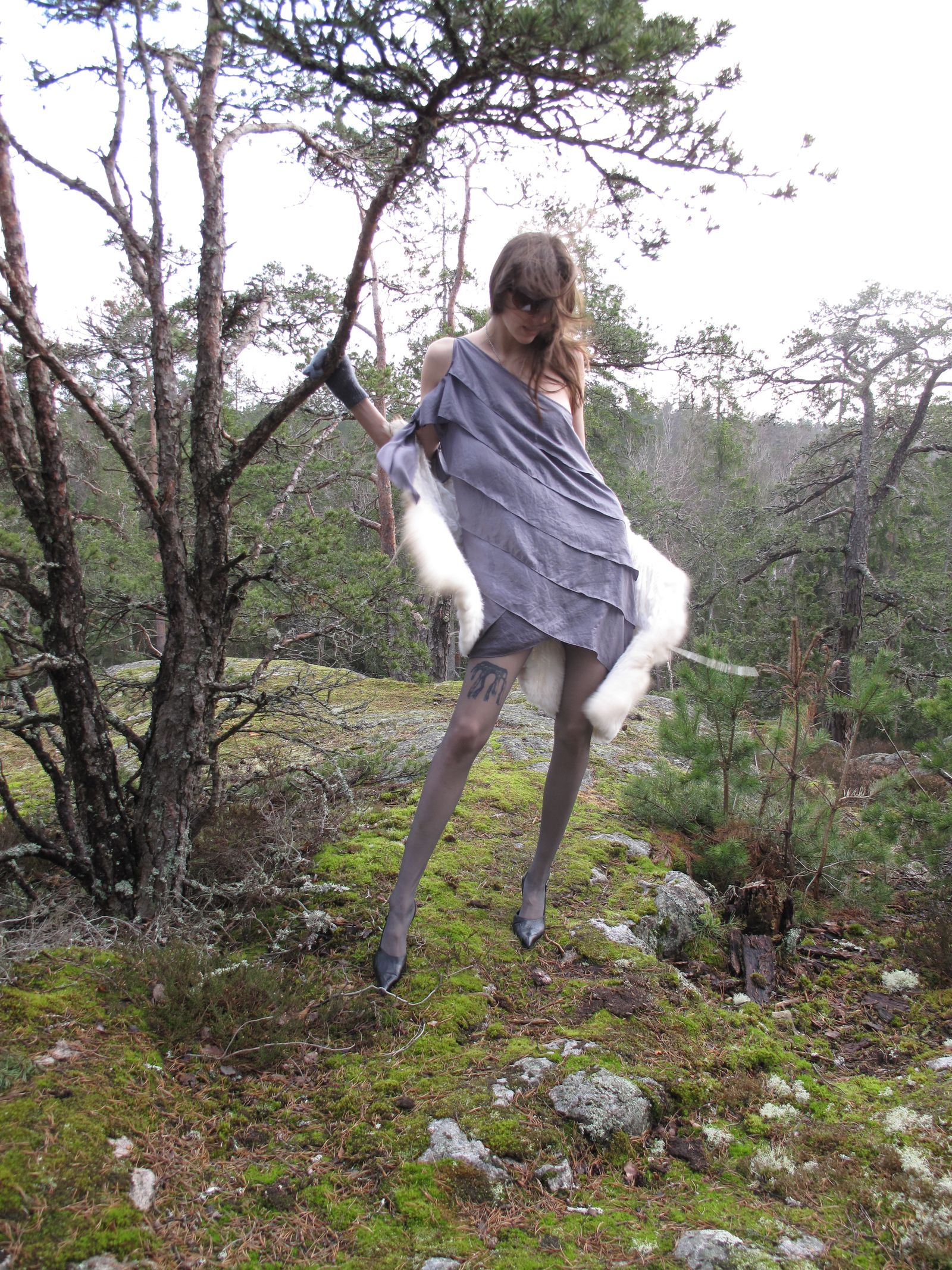 Image may contain plants, vegetation, nature, outdoor, wilderness, trees, woodland, clothing, gloves, adults and people