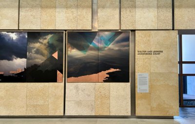 View of the photo-based installation, with images layered on copper sheets.