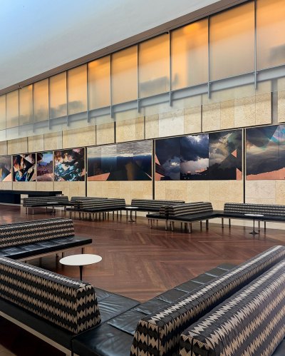 View of the photo-based installation, with images layered on copper sheets.
