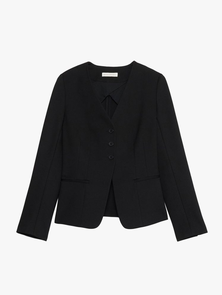 Image may contain: blazer, clothing, coat, jacket, formal suit, suit and tuxedo