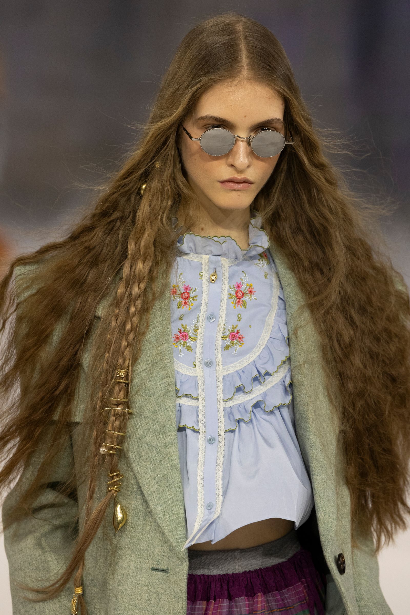 Image may contain brown hair, hair, teen braids, clothes and coats