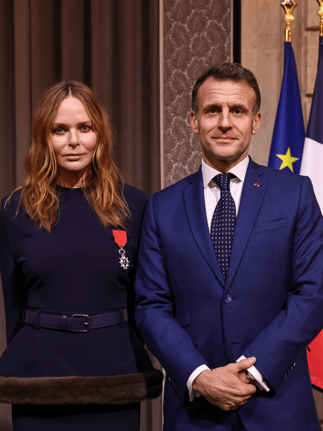 Image may contain Emmanuel Macron Stella McCartney Adult Clothing Formal Suits characters and accessories