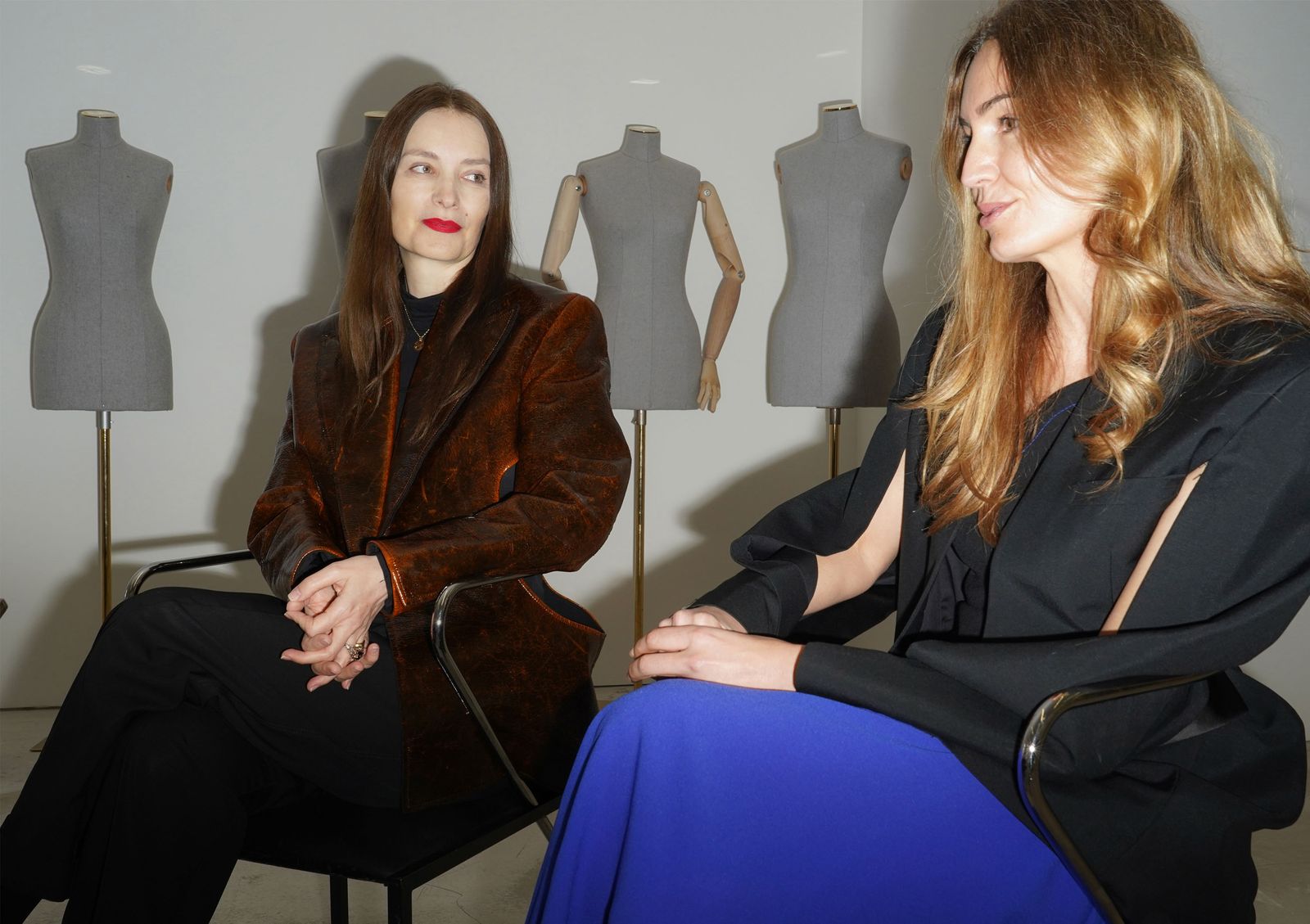 Image may contain Roksanda Ilincic clothing coat jacket adult shirt blazer long sleeves and sleeves