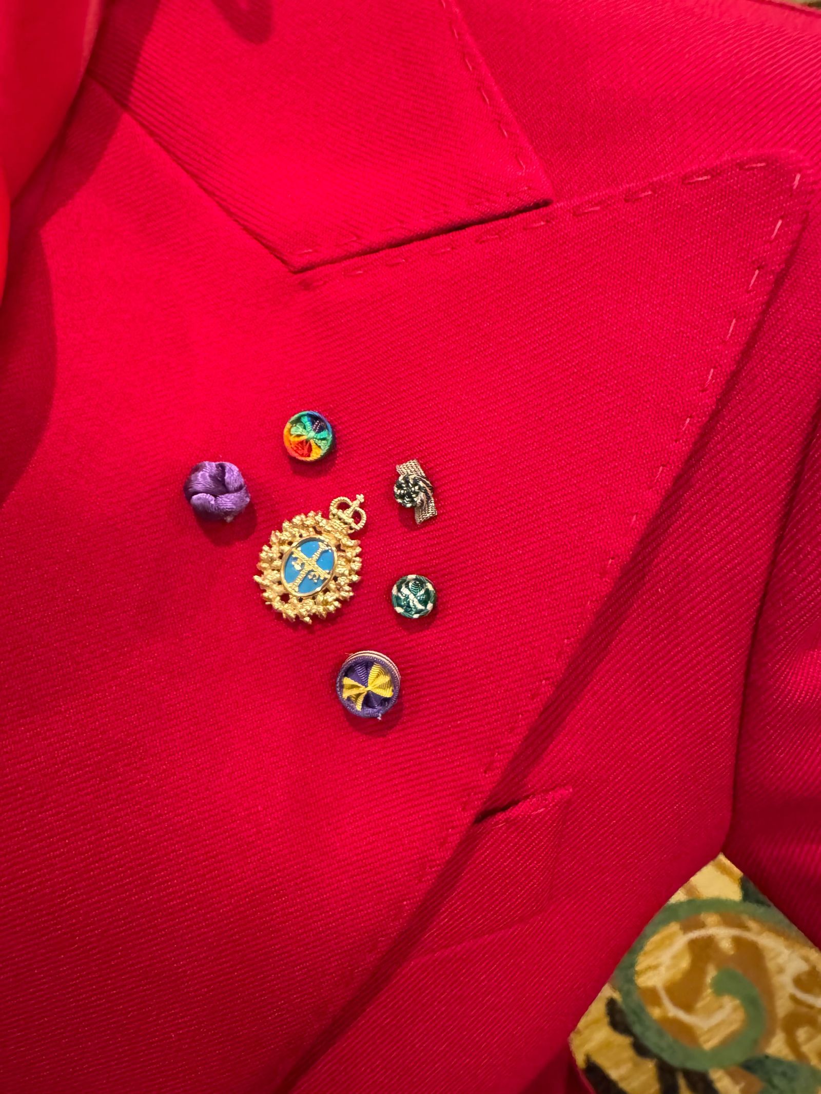 Images may contain accessories, patterns, jewelry, formal wear, coats, jackets, earrings and dresses