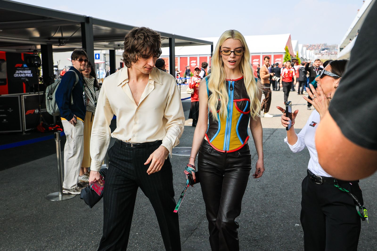 Suzuka, Japan, March 29 Anya TaylorJoy and Malcolm McRae take a walk in the paddock during the Japanese F1 Grand Prix in Suzuka…