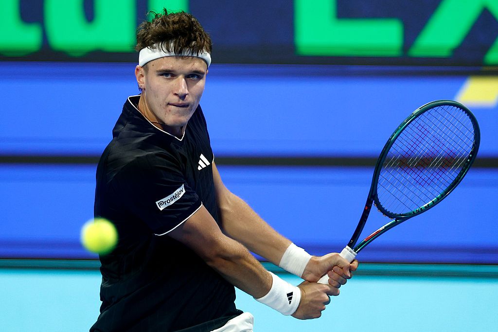 Image may contain racket sports tennis tennis racket adults and people