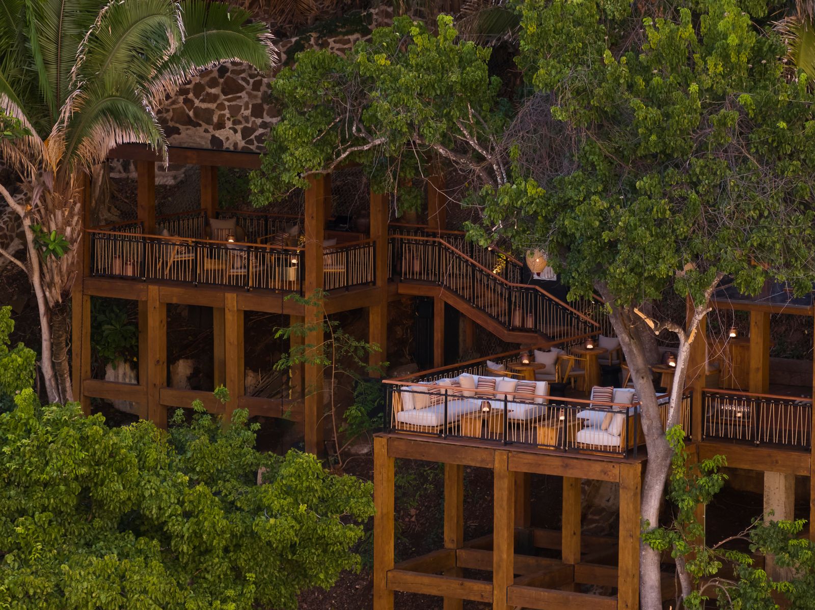 Image may contain building, building, hotel, resort, wooden deck, house, house, porch, plants, vegetation and trees