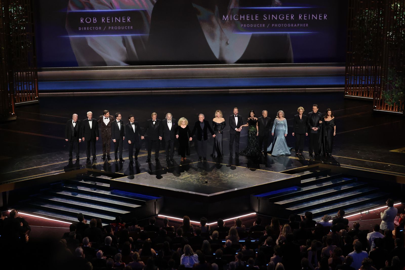 Image may contain Meg Ryan Crowd Adult Wedding Group Performance Stage Audience Costumes and Formal Wear