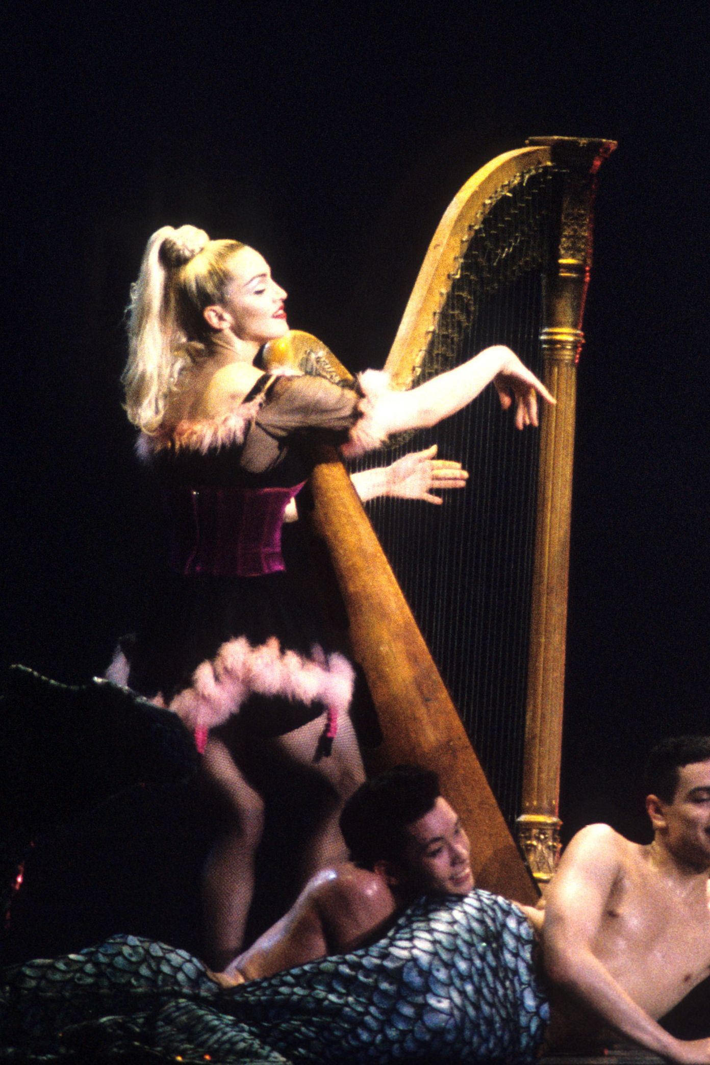 Image may contain Kevin Stea Madonna Adult Face Head Photography Portrait Instrument and Harp