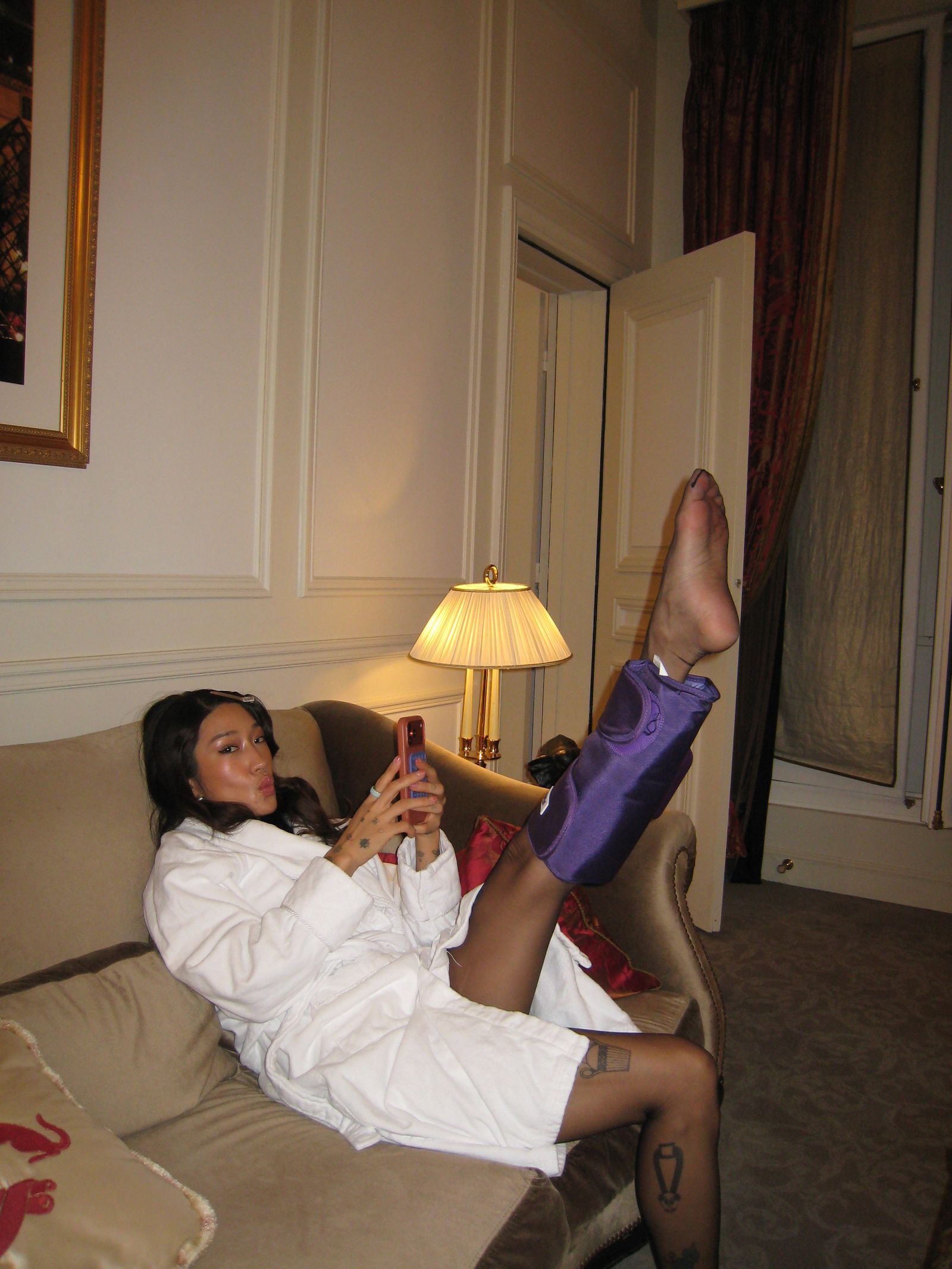 Image may contain Jihae Lamp Couch Furniture Face Head Person Photography Portrait Adult Clothing and Footwear