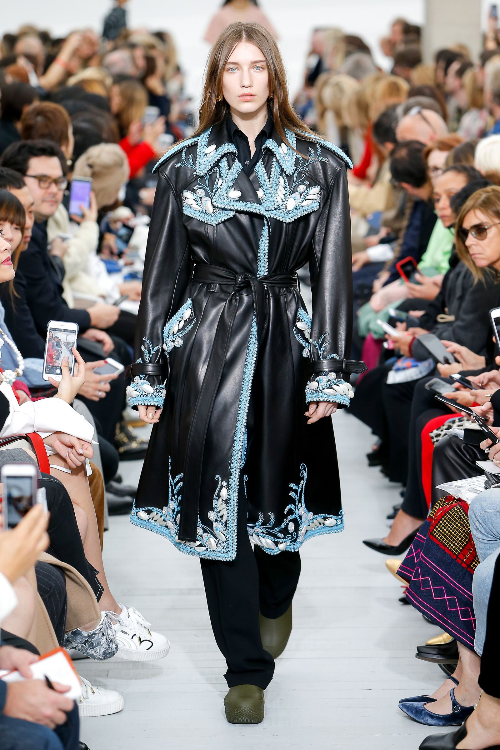 This image may contain clothing sleeves clothing long sleeves people women women and footwear